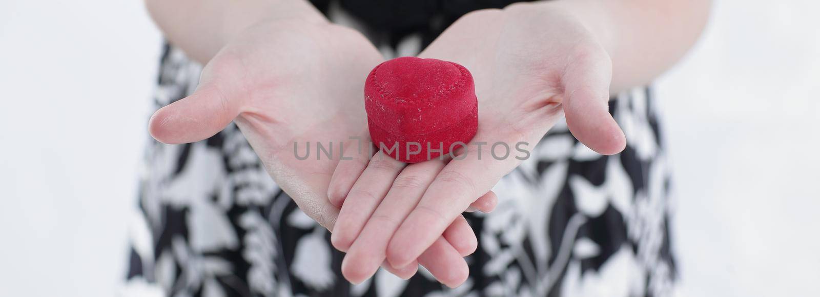 closeup.young woman holding gift on Valentine's day