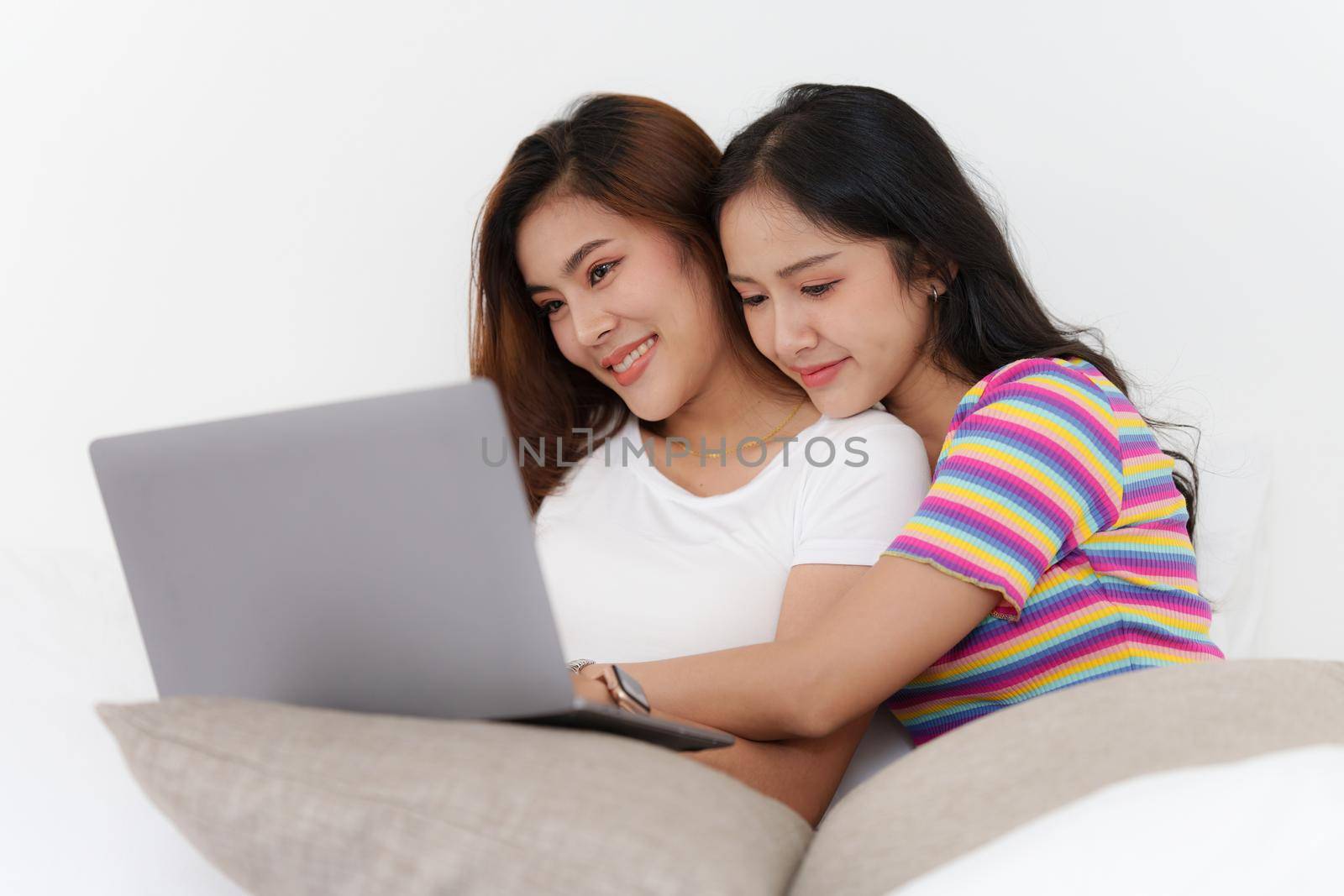 Young Asian Women LGBT lesbian couple love moments happiness at bedroom. LGBTQ or Gay and pride concpet. by itchaznong