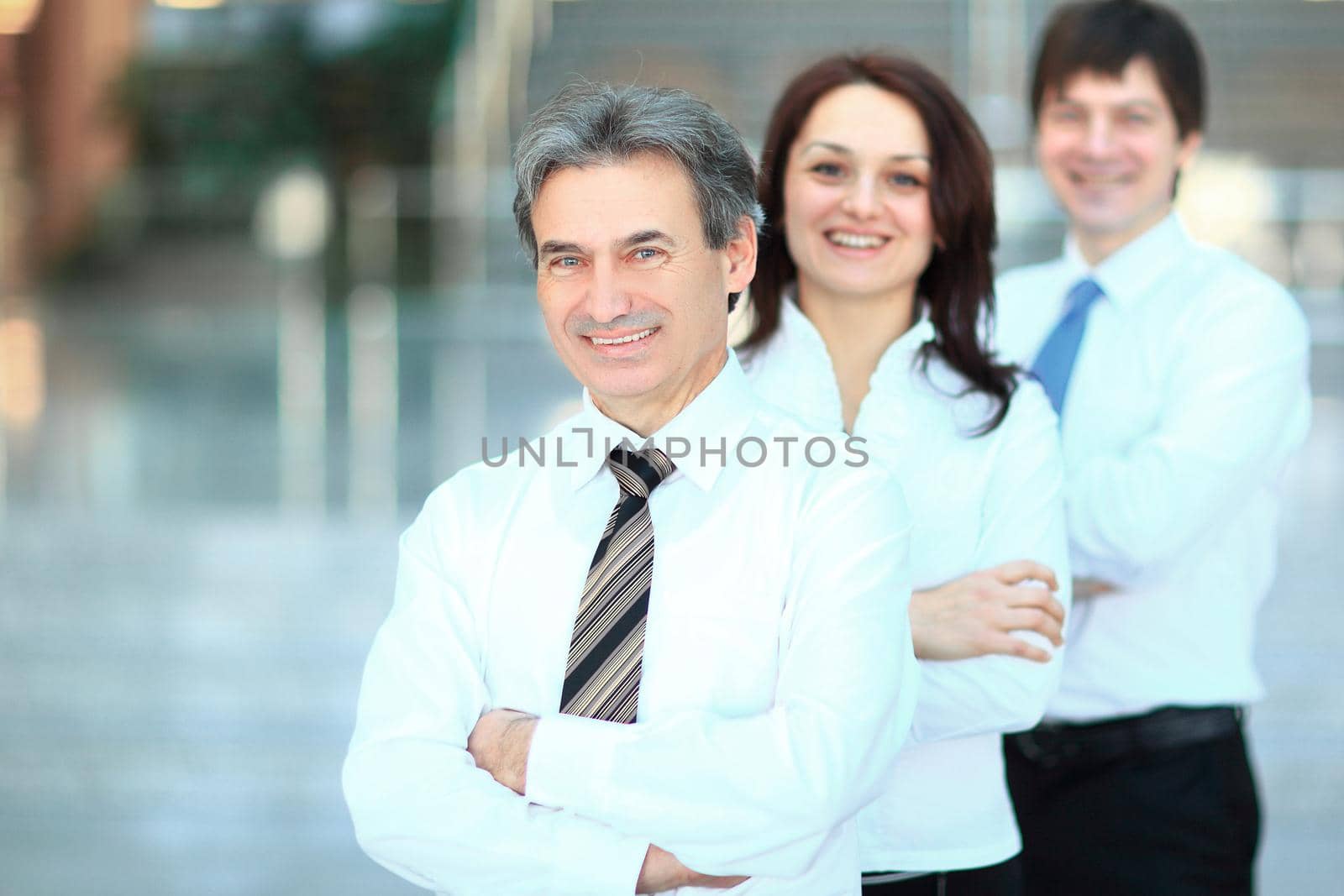 in full growth. portrait of confident business team in the office. by SmartPhotoLab