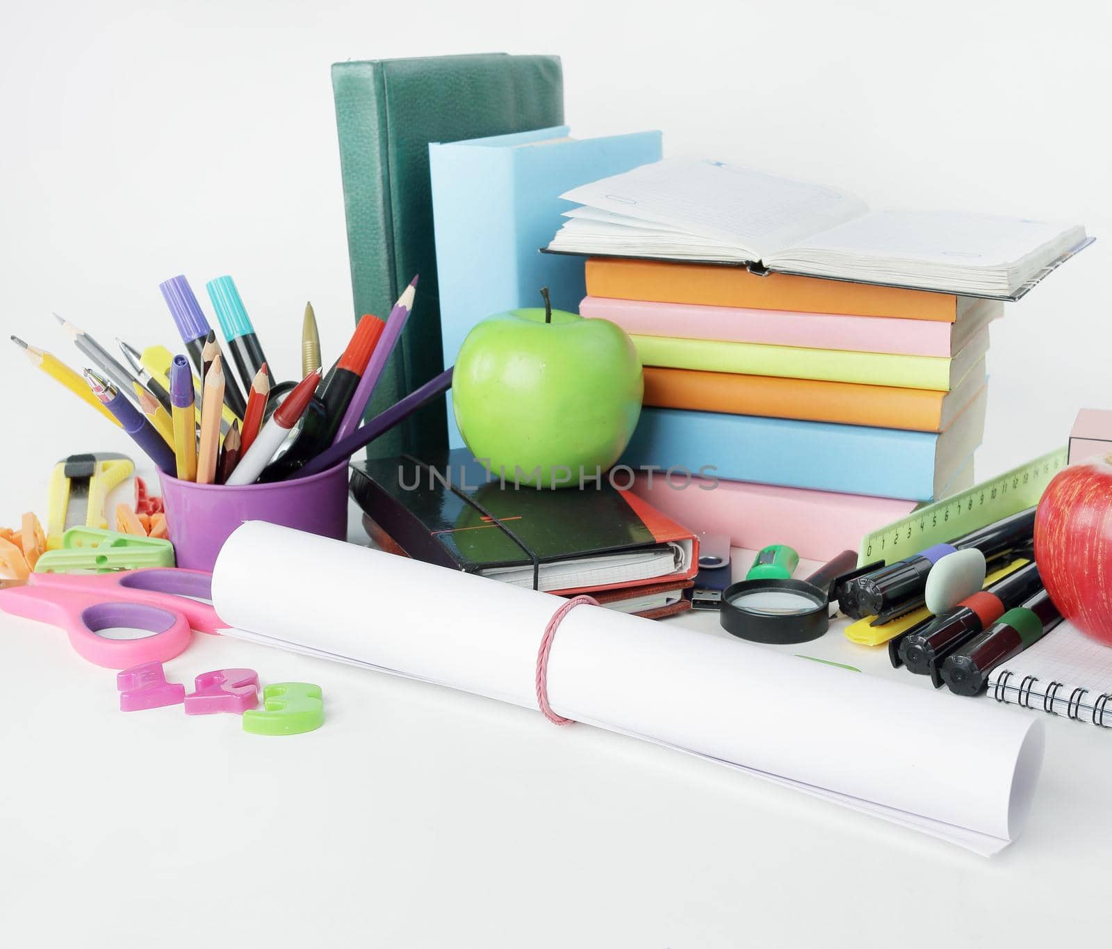 close up.a sheet of drawing paper and school supplies isolated on white background.