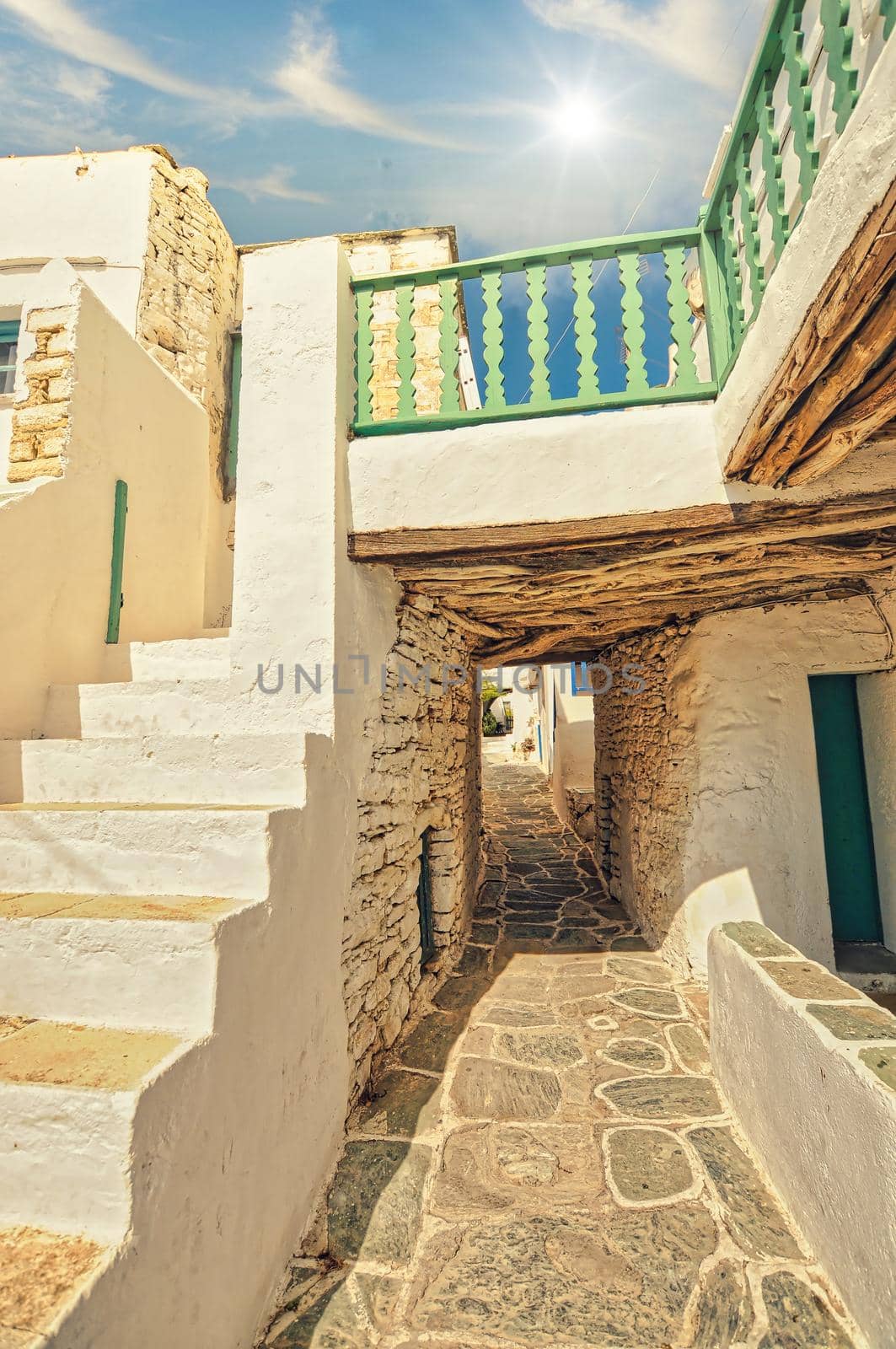 View of the narrow side road in Kastro, old castle in Chora. Characteristic Greek buildings. Folegandros Island, Greece...