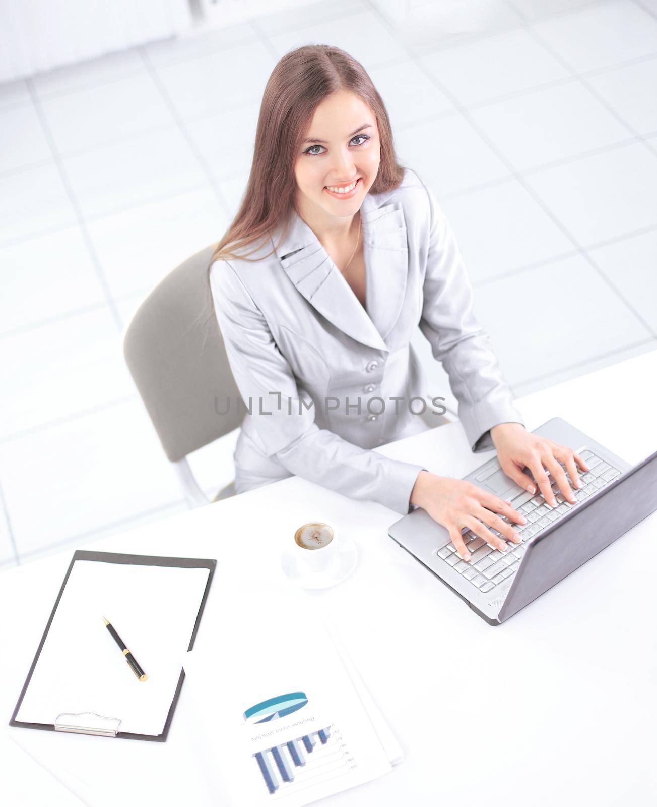 view from the top.business woman working on laptop.photo with copy space.