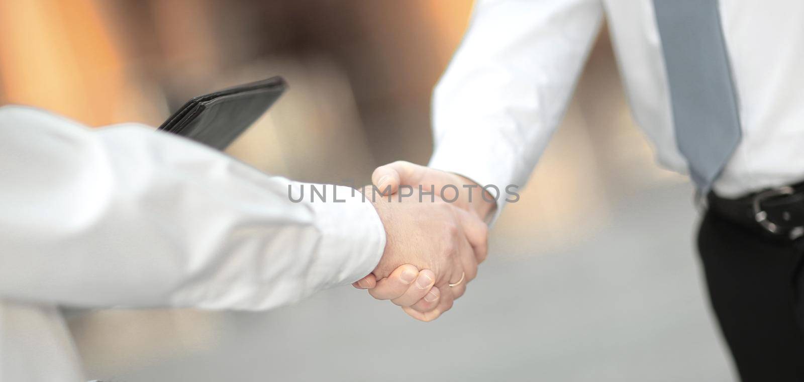 closeup .handshake business people in the office by SmartPhotoLab