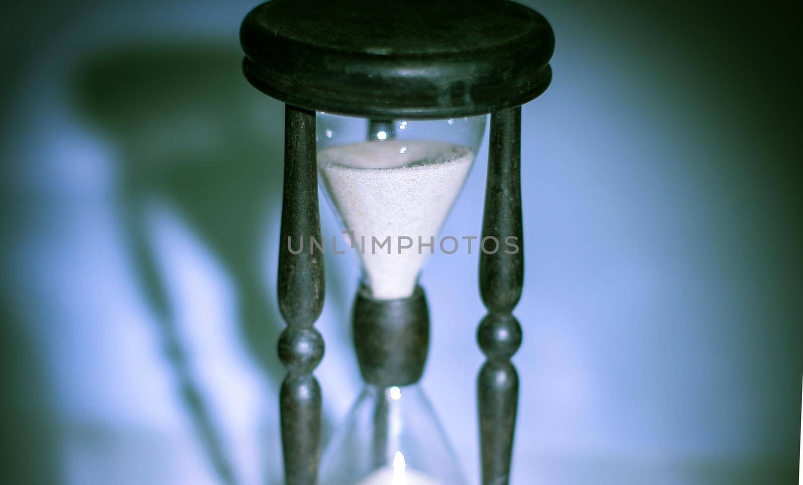 hourglass on dark background.the concept of time.photo with copy space