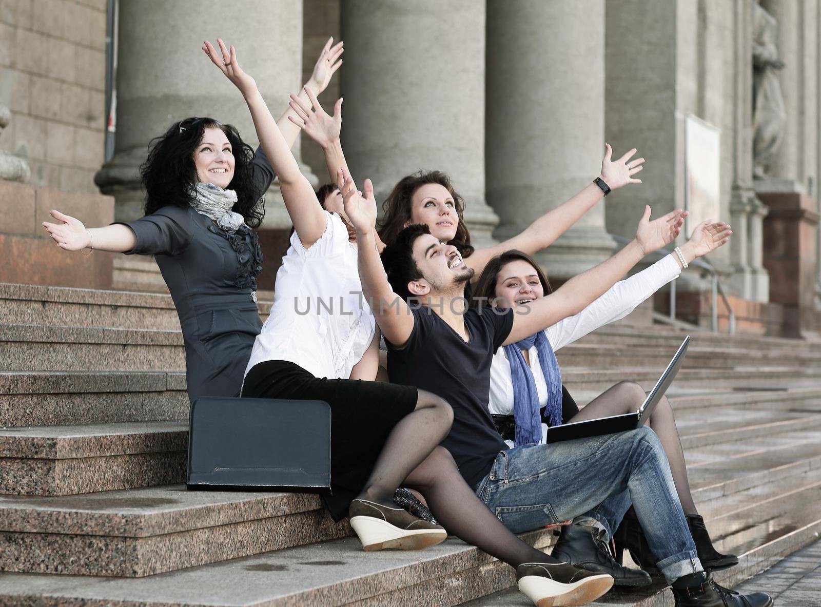 group of happy university students in front of university building by SmartPhotoLab
