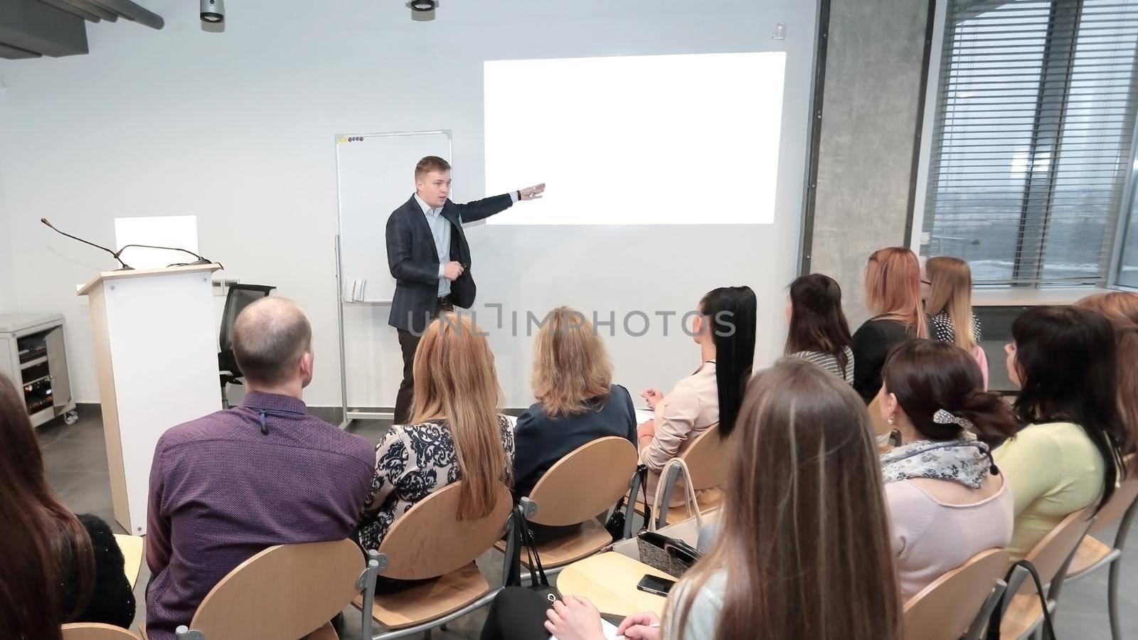 Manager makes a presentation to his business team by SmartPhotoLab