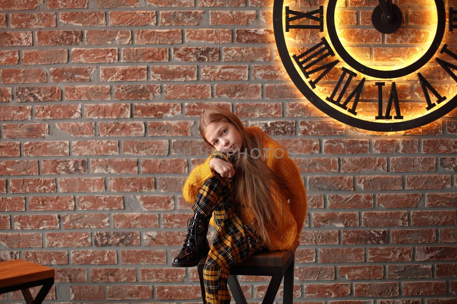 cute girl sitting in the living room with Christmas decor by SmartPhotoLab