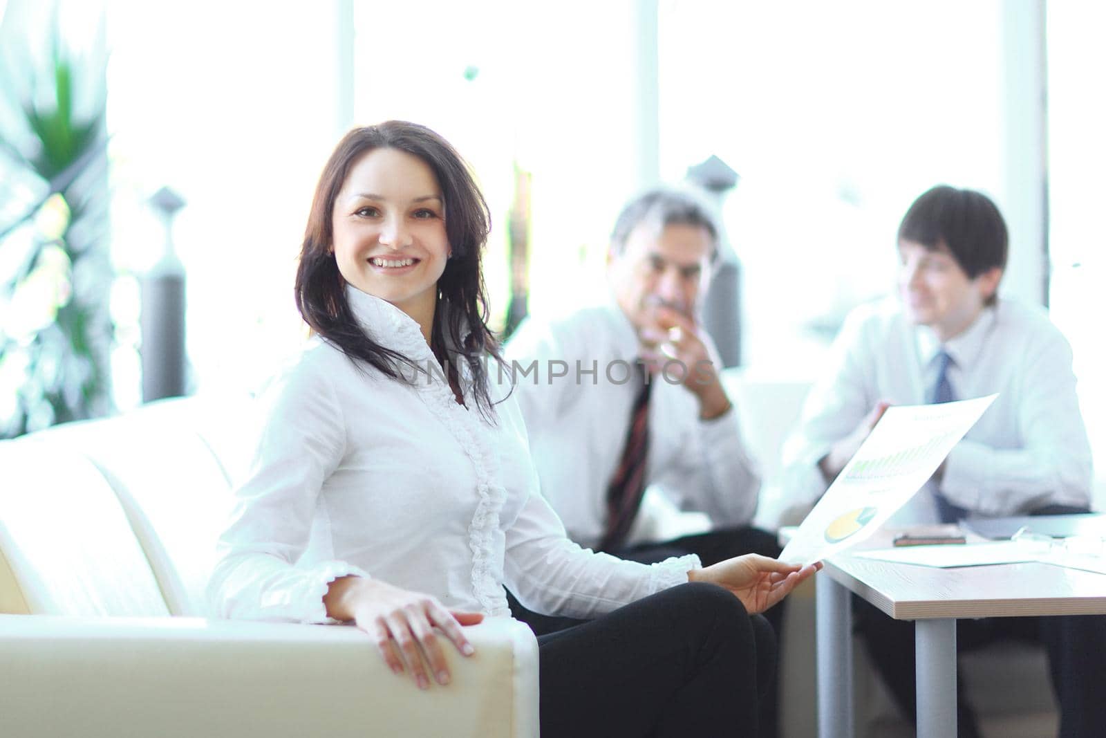 portrait of business woman on the background of colleagues.photo with copy space