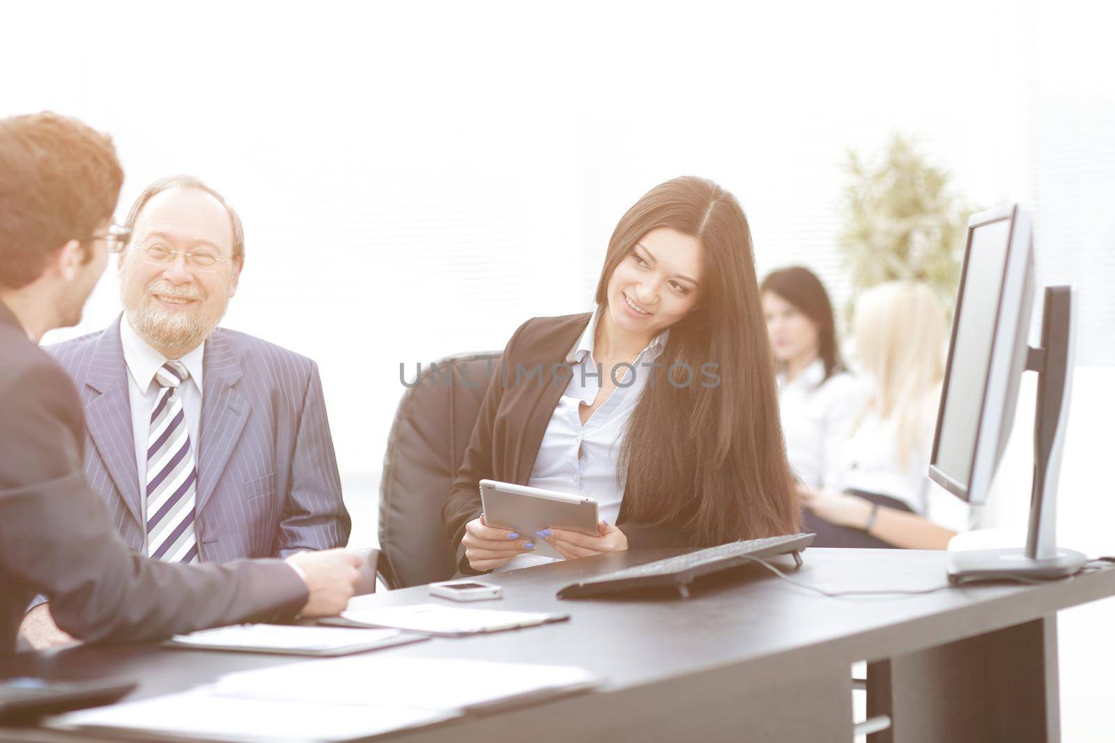 business colleagues at their Desk in the office .photo with place for text