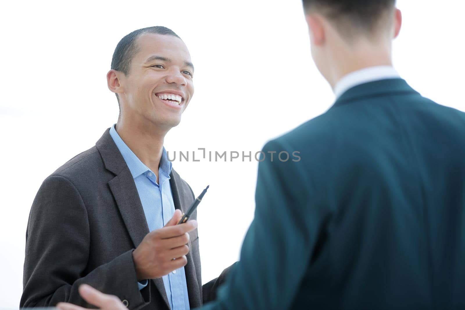 closeup.business colleagues discussing work issues standing in office