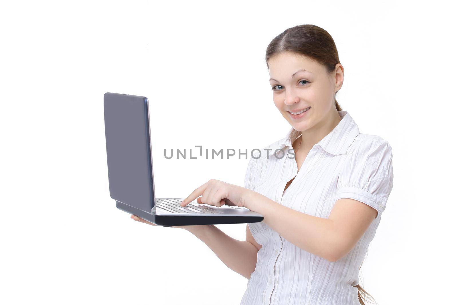 young woman dealer shows an open laptop. isolated on a white background. by SmartPhotoLab