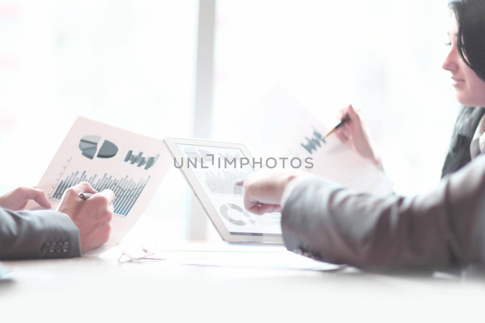 business team is discussing financial schedules. photo with copy space by SmartPhotoLab
