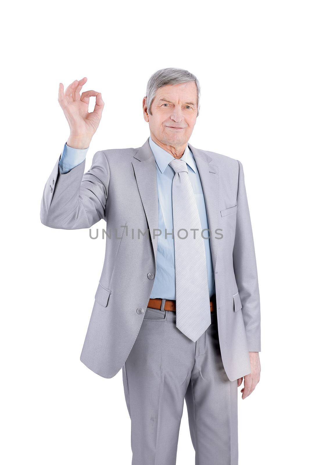 closeup.handsome senior businessman showing OK gesture. isolated on white. by SmartPhotoLab