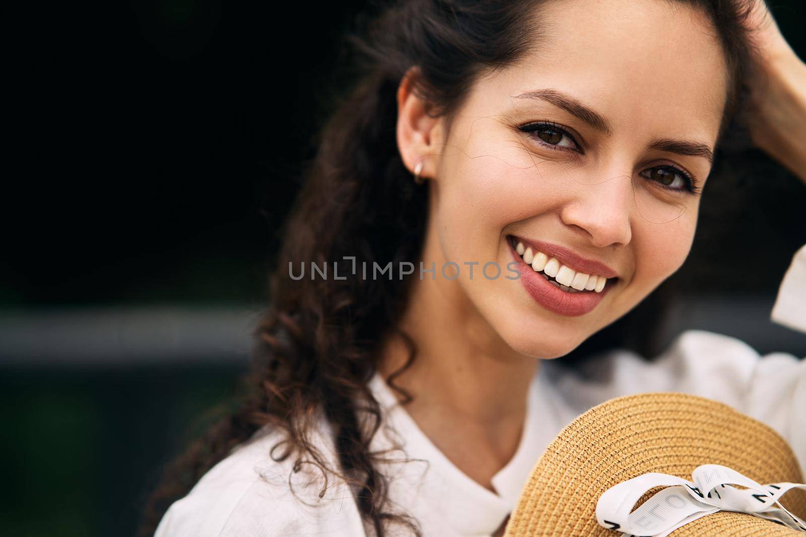 Young beautiful girl in a hat in a summer park. High quality photo