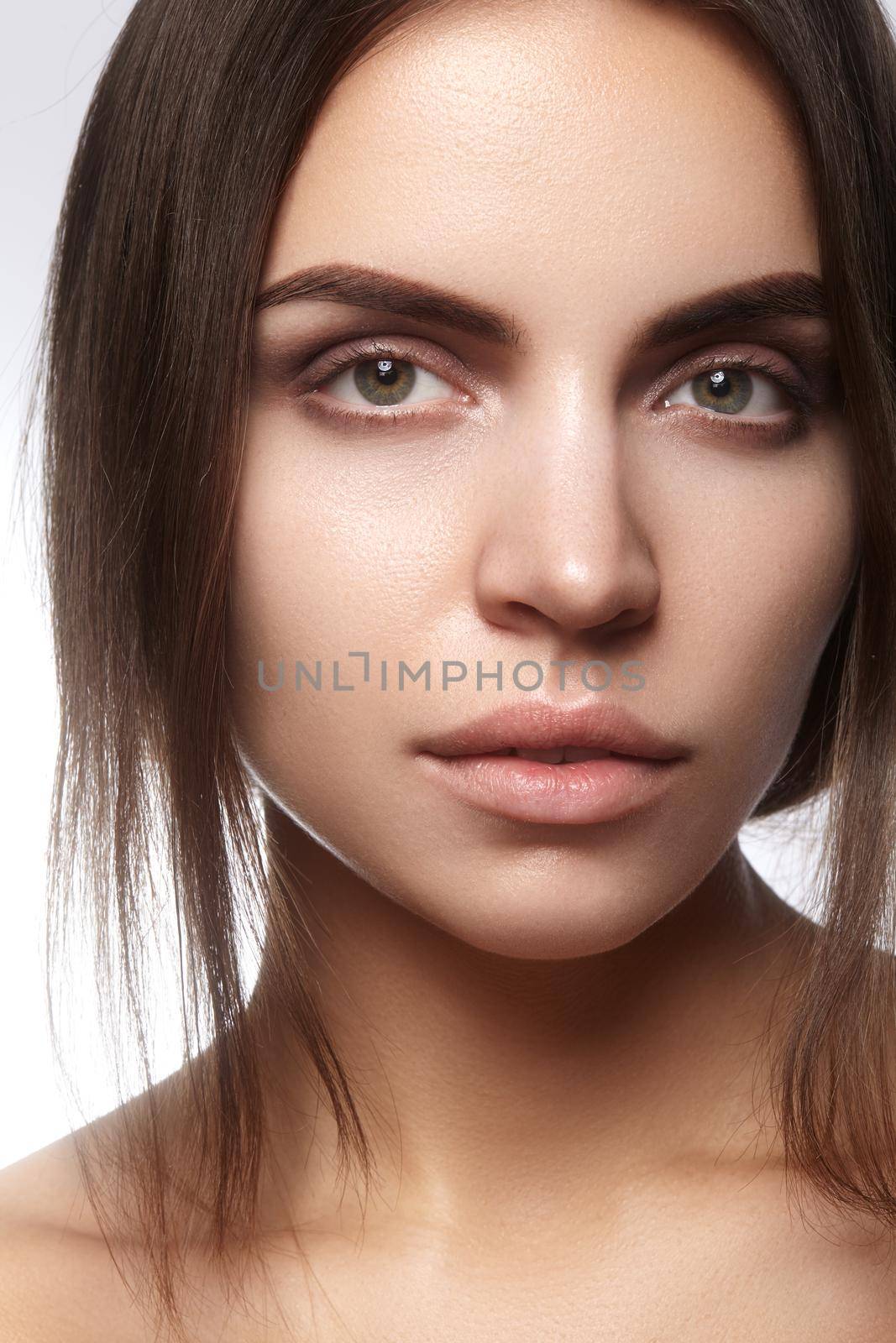 Beautiful face of young woman. Skincare, wellness, spa. Clean soft skin, healthy fresh look. Natural daily makeup by MarinaFrost