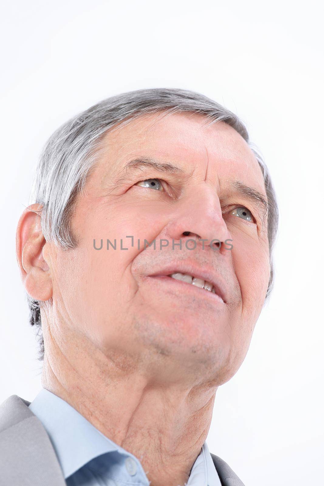 closeup.confident senior businessman looking up at copy space .photo with copy space