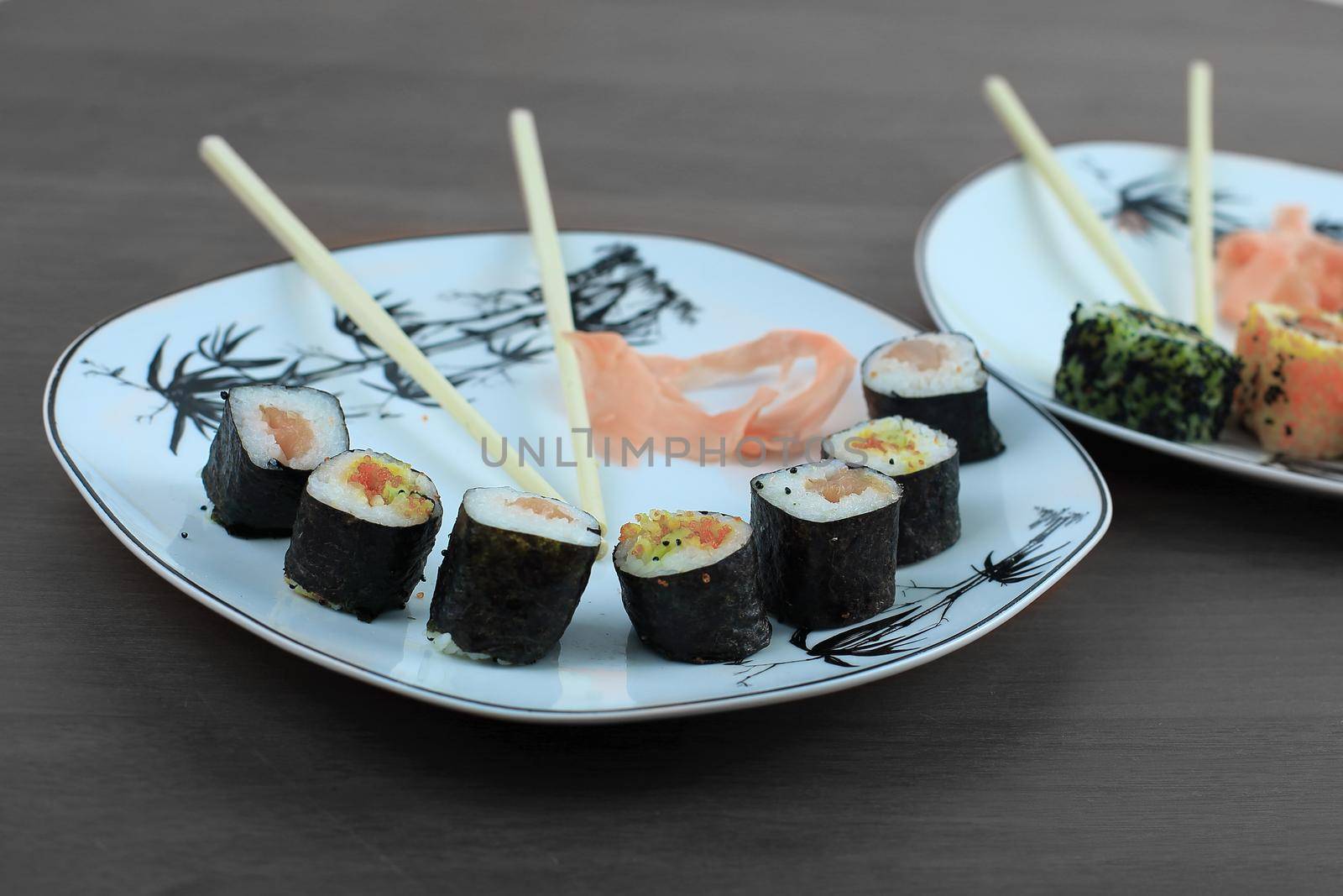 Sushi is the traditional Asian and Japanese food. Roll of sushi prepared from raw fish and a special rice.