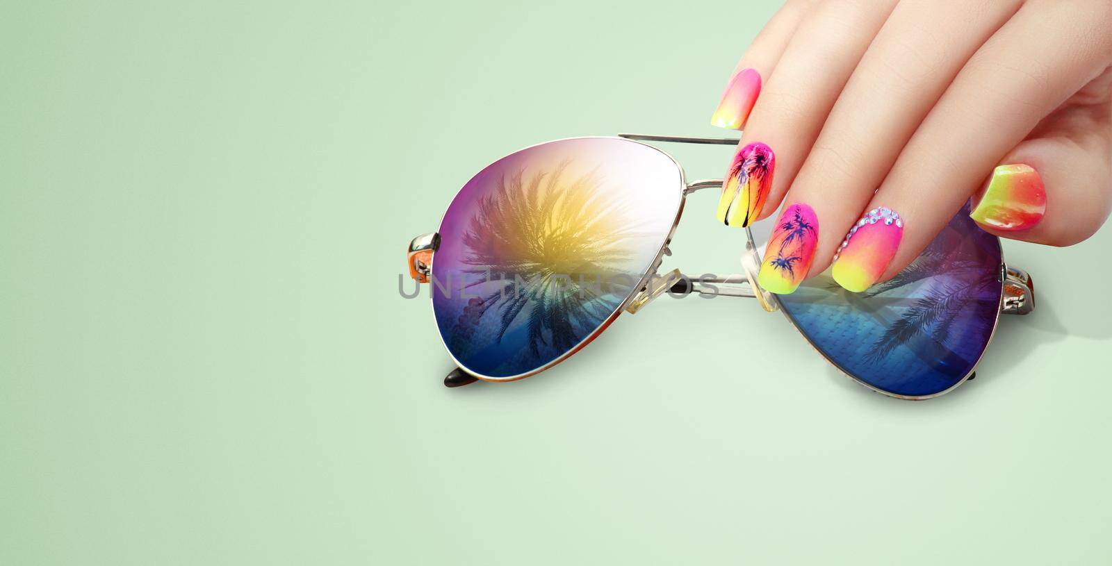 Summer fashion and beauty hand care concept with sunglasses by Taut