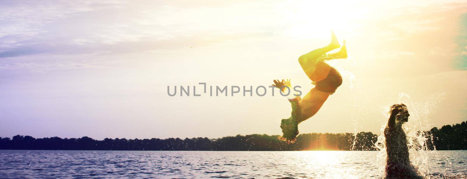 Group of friends having fun on the beach. by Taut