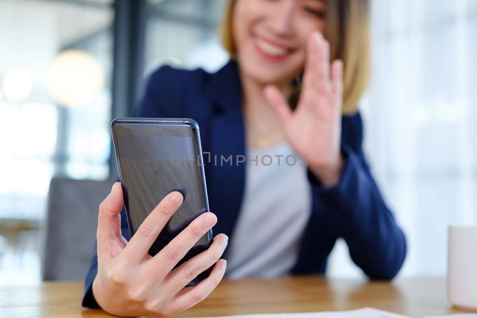 Young woman using a mobile phone by ijeab