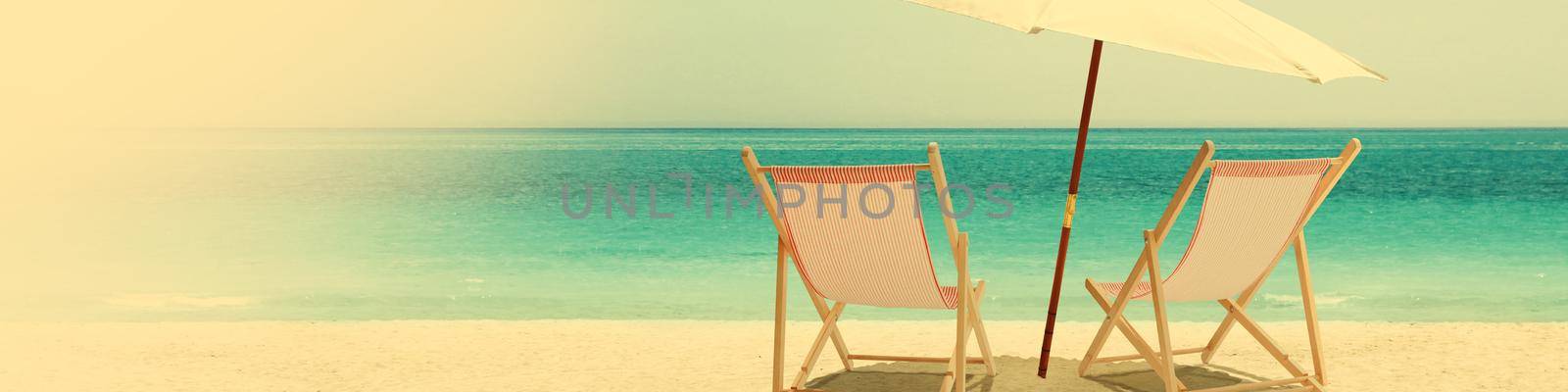 Relax on tropical beach in the sun on deck chairs. by Taut