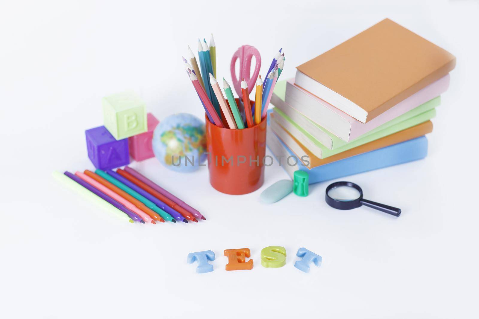 word test on the background of school supplies .photo with copy by SmartPhotoLab