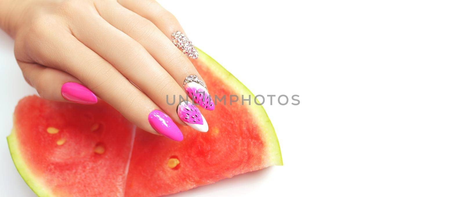 Hand with fashion manicure holding watermelon on white background. by Taut