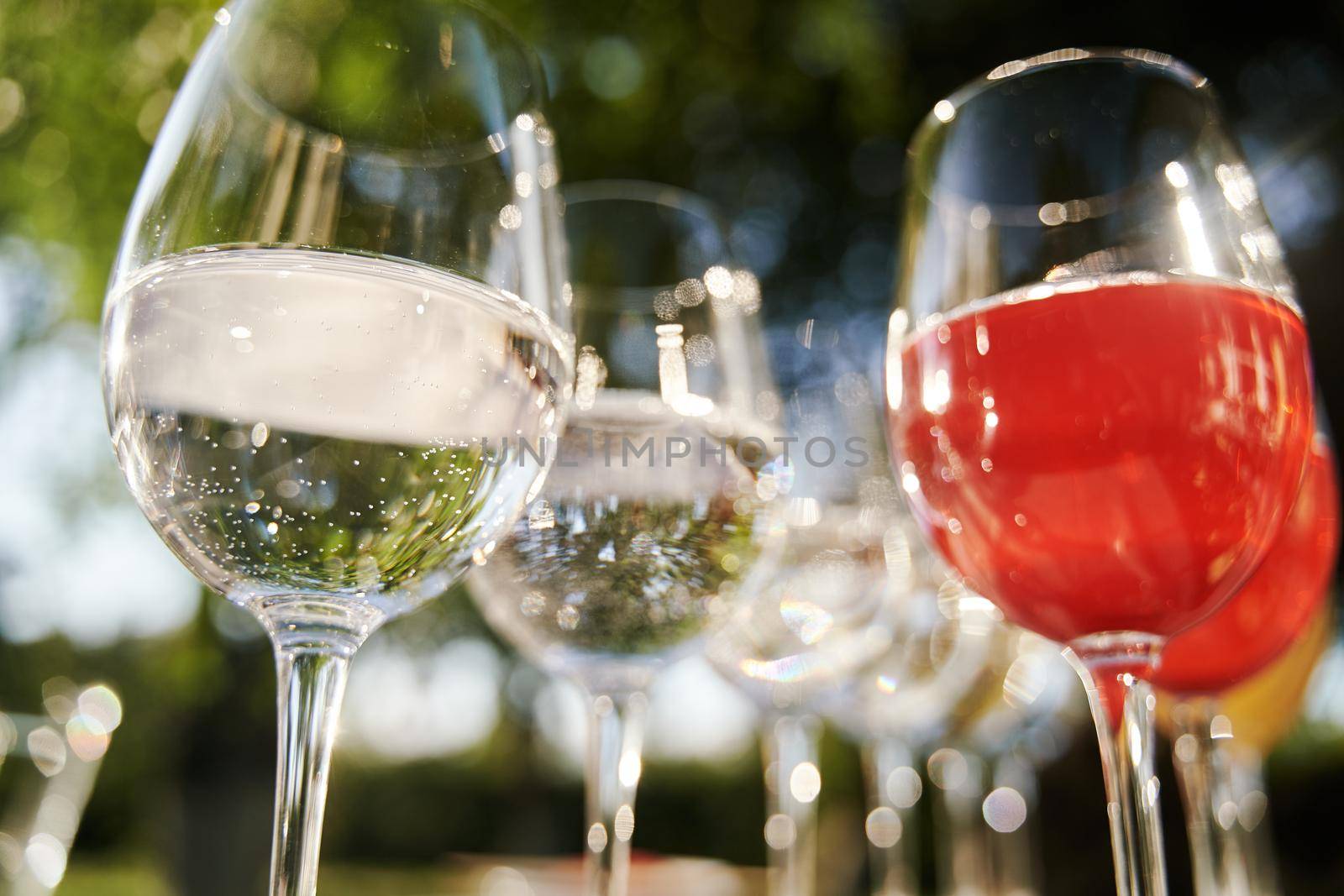 Table set for an event party or wedding reception. Banquet table design. Festive glasses with champagne and white wine.