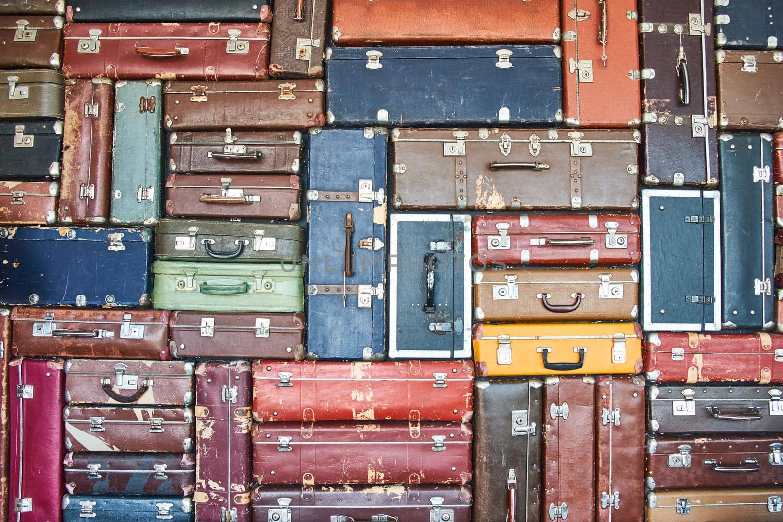 Suitcases for travel. Multicoloured suitcases for clothes. Background. Texture.