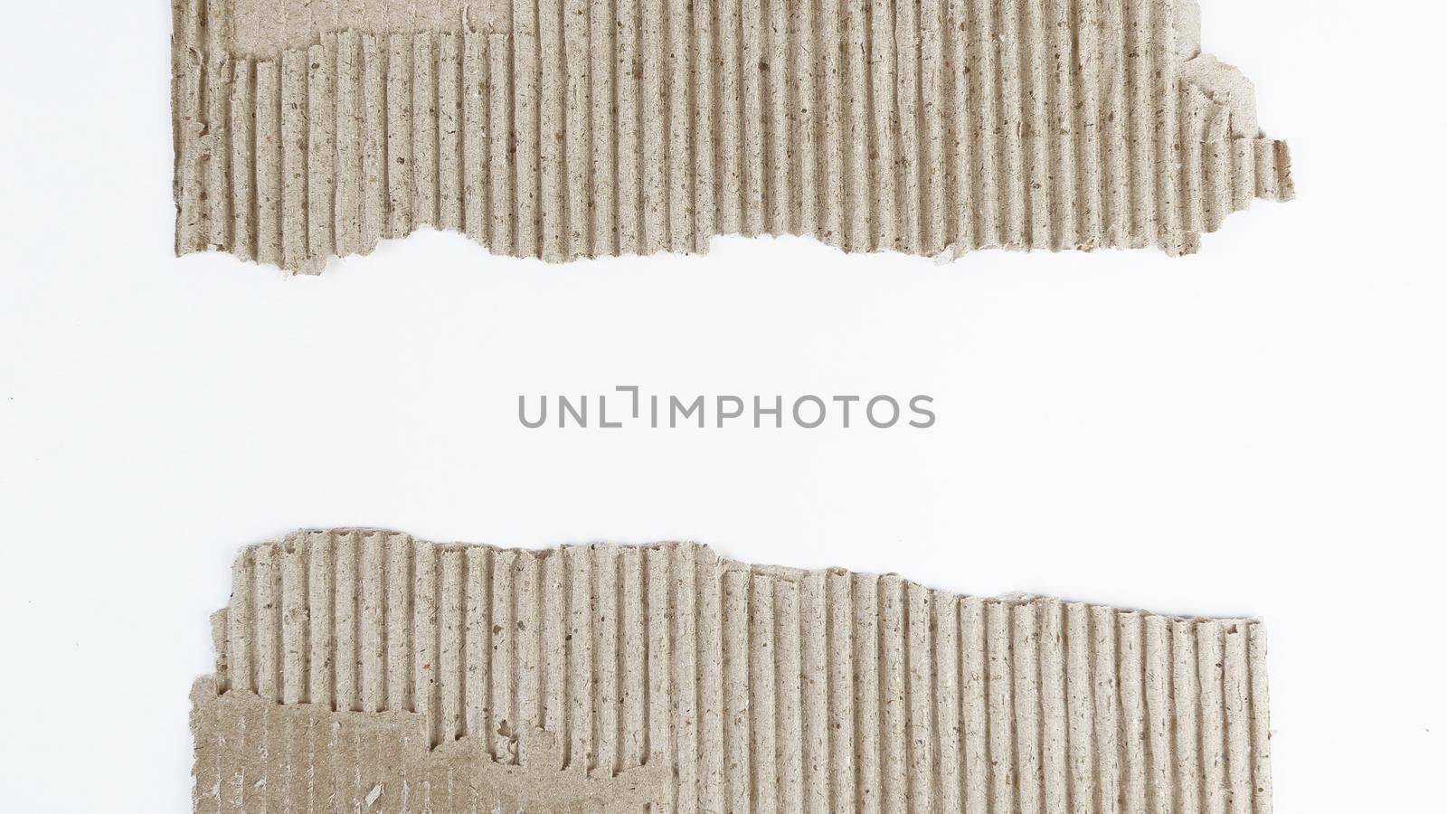 creative background .two torn piece of cardboard on white background