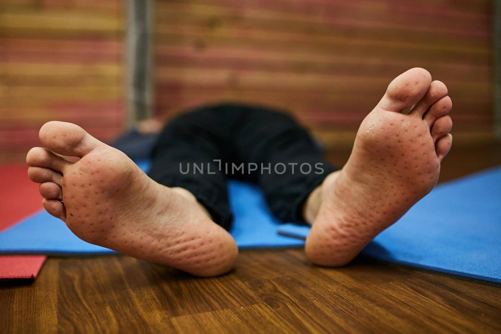 Feet of a man close-up after standing on nails.