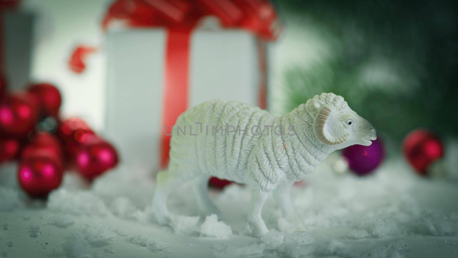 toy sheep and boxes with gifts on Christmas background by SmartPhotoLab