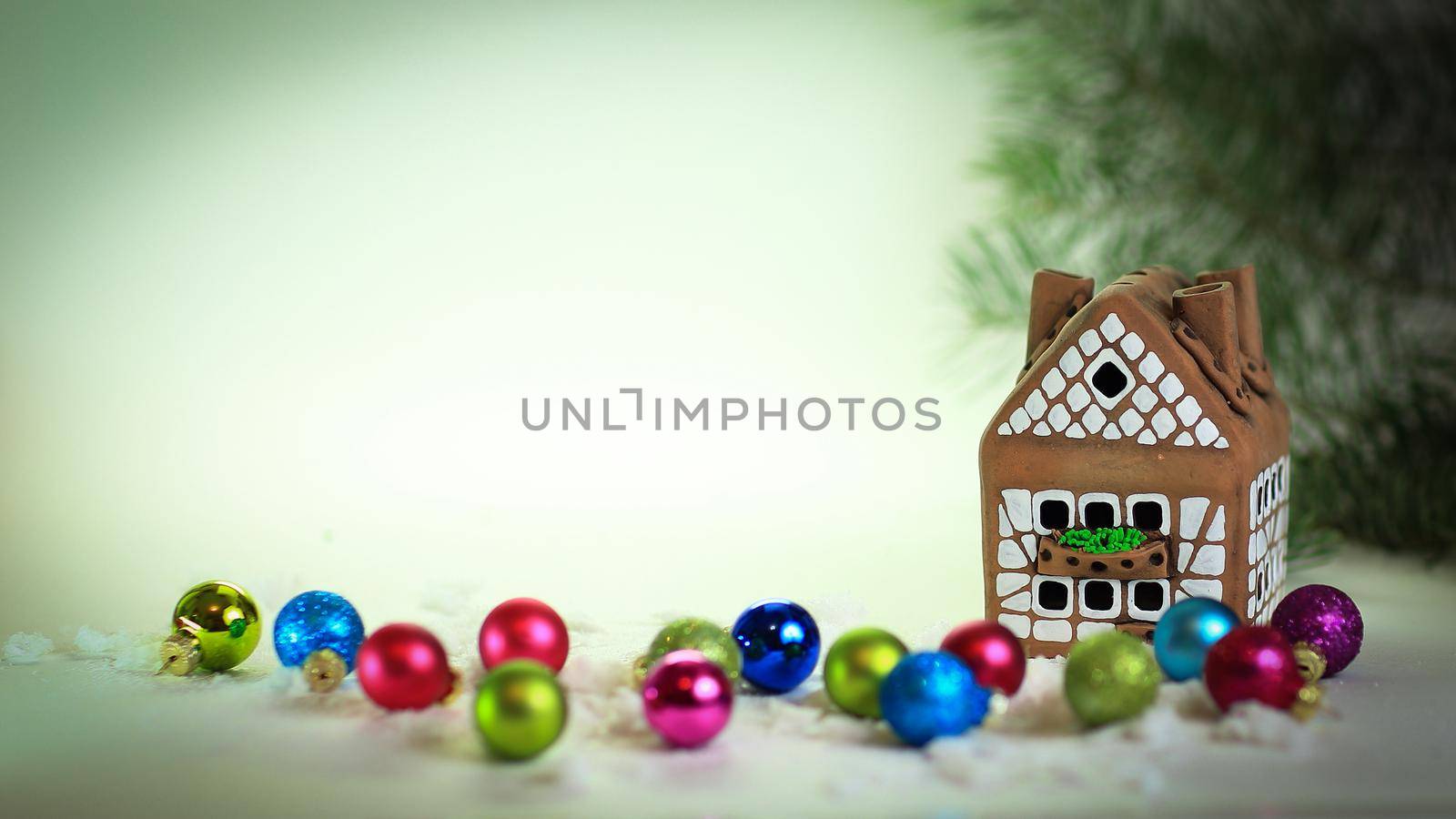 gingerbread house and gifts, at a Christmas background. photo with copy space.
