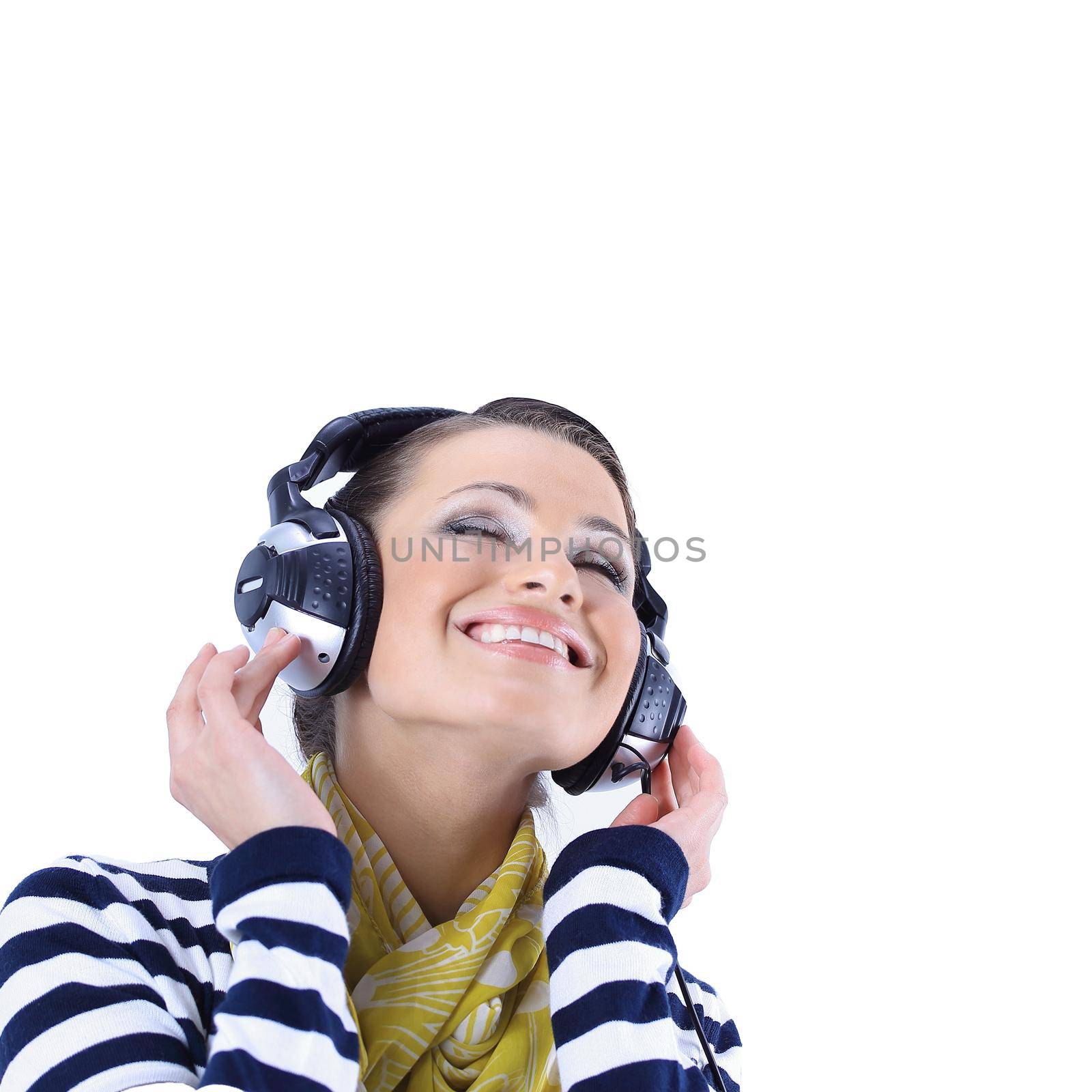 closeup .stylish girl listening to music with headphones by SmartPhotoLab