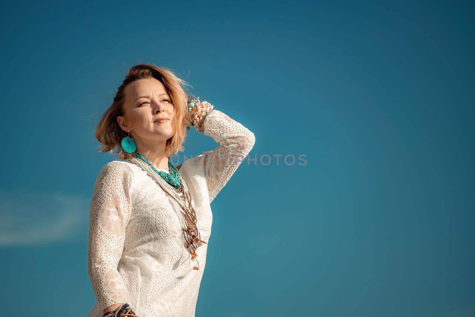 fashionable young model in boho style dress