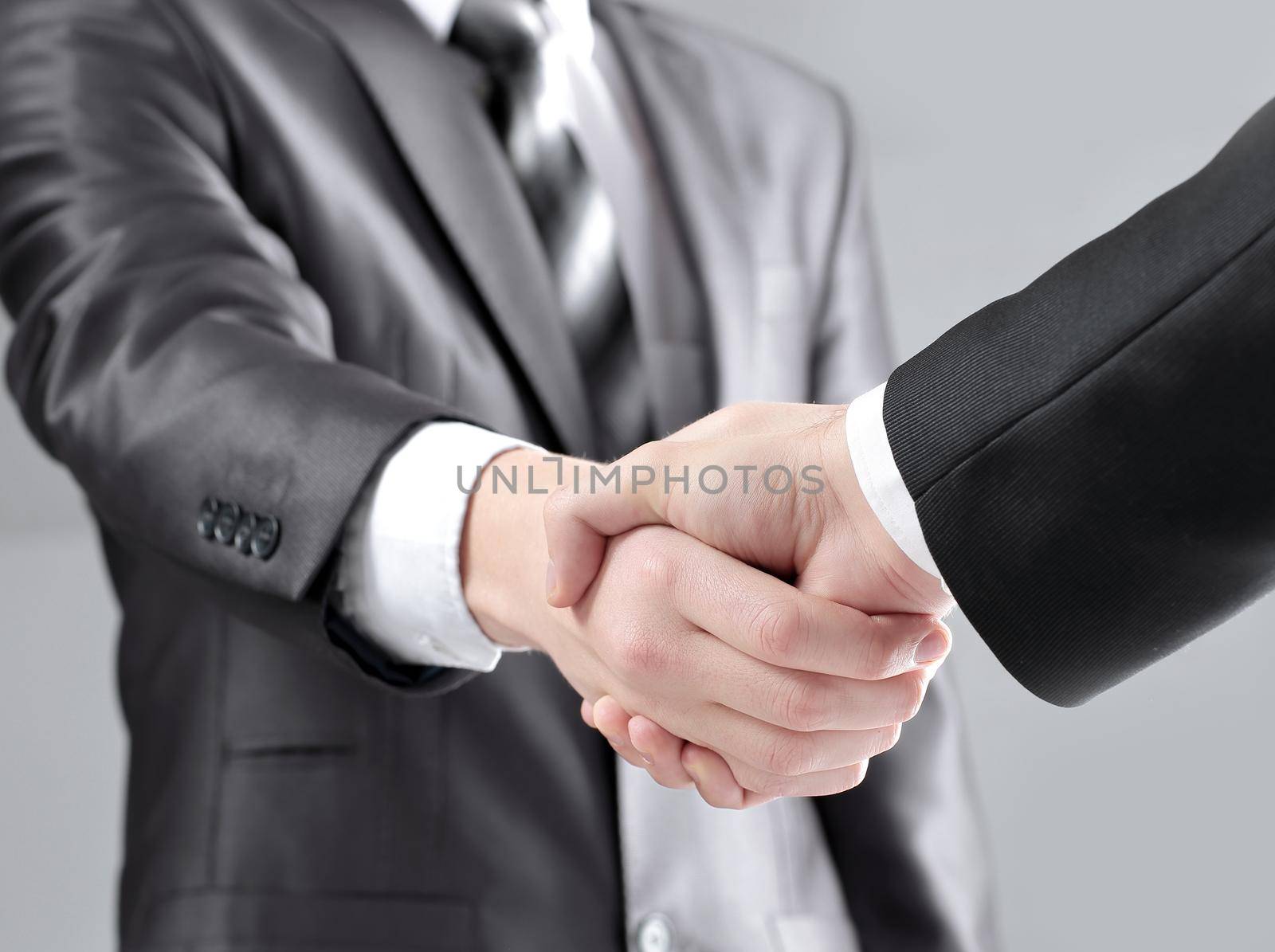 close up. handshake business people the concept of cooperation by SmartPhotoLab