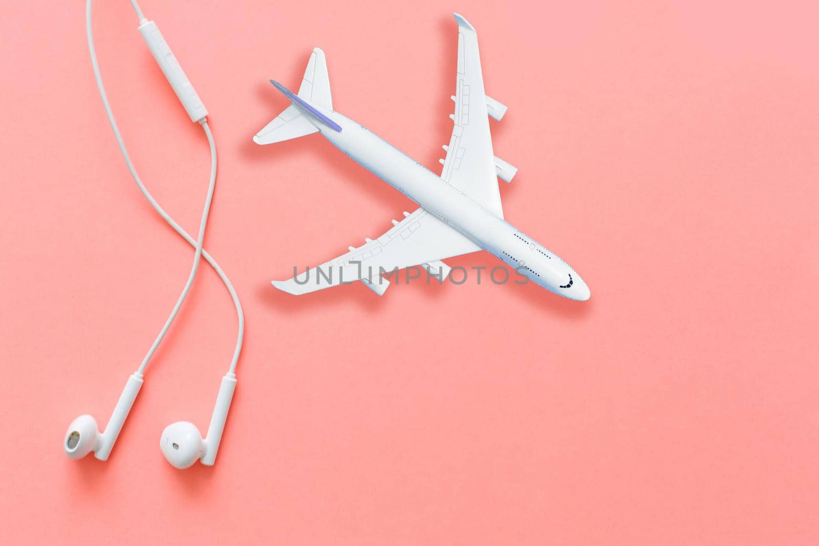 Model plane, airplane on pastel color background. Flat lay design