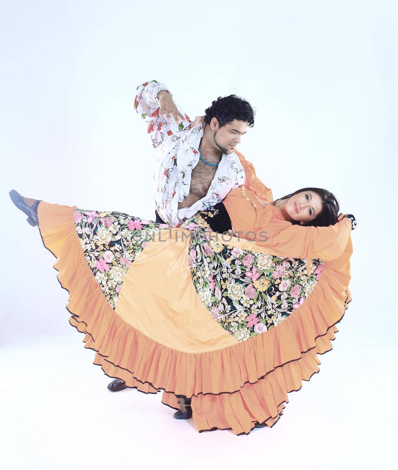 professional dance couple in a Gypsy costume perform folk dance by SmartPhotoLab