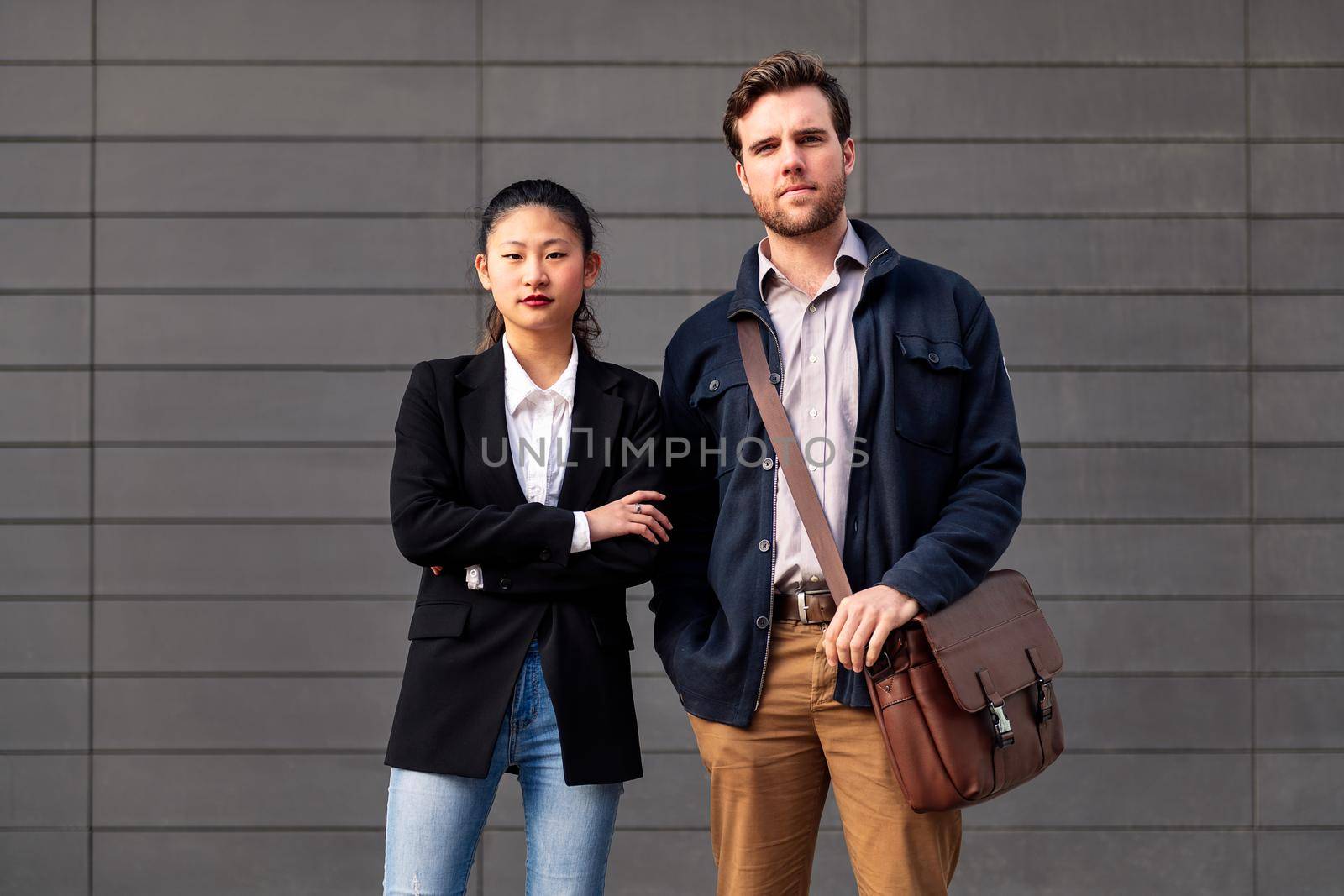 confident entrepreneur young couple looking at camera, concept of entrepreneurship and business, copy space for text