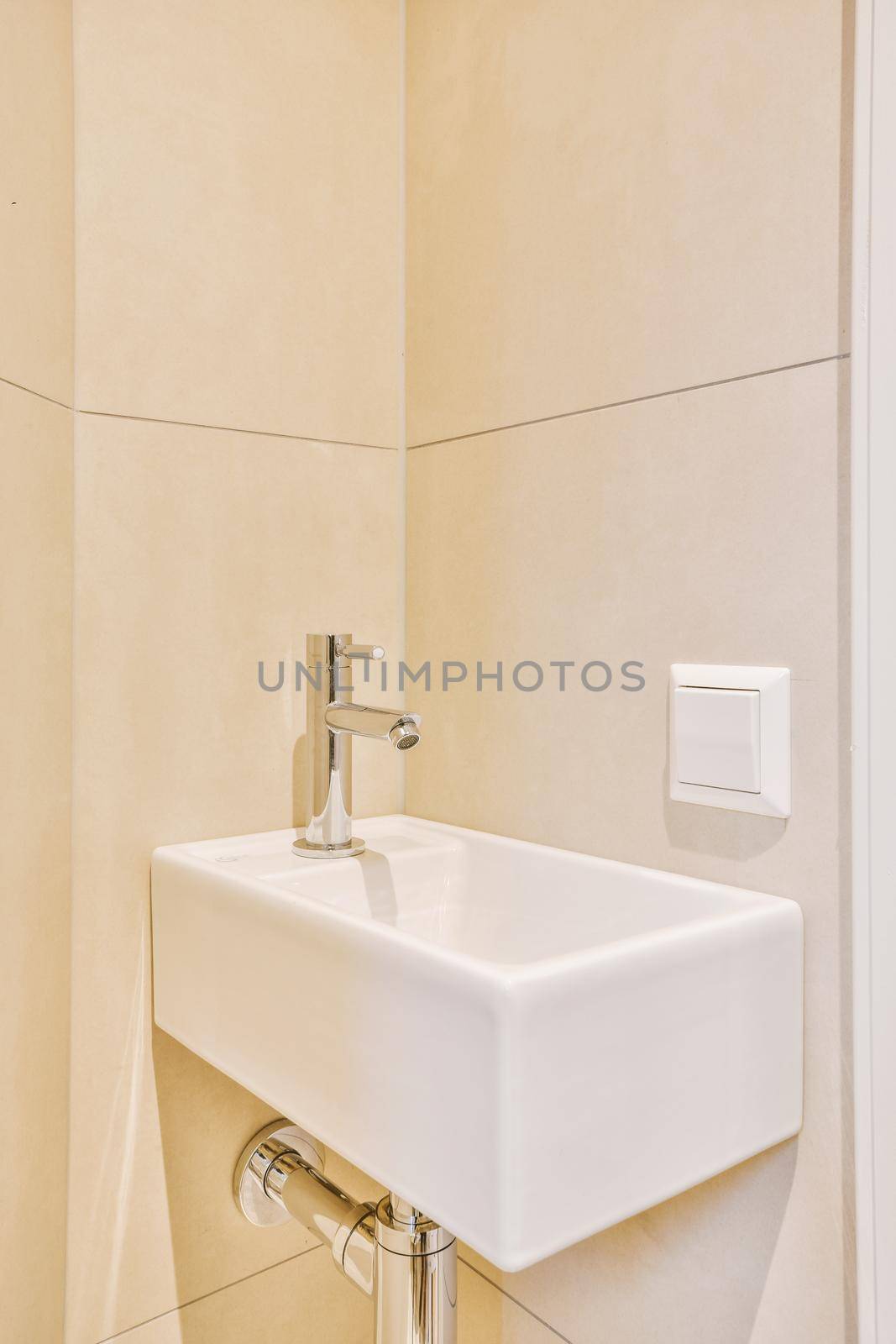 Sink with tap installed on tabletop in contemporary bathroom at home