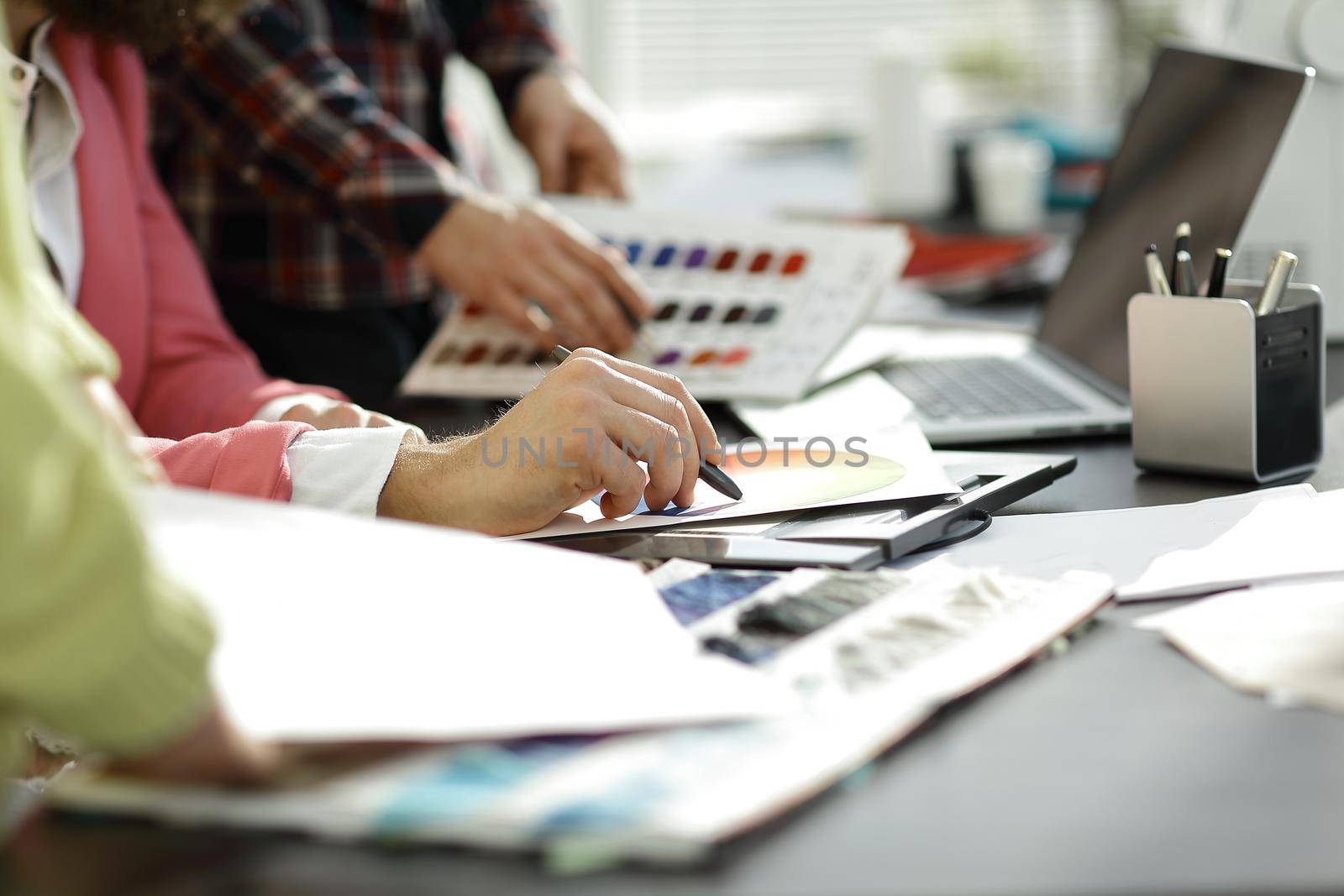 close up.fashion designer working with color palette.