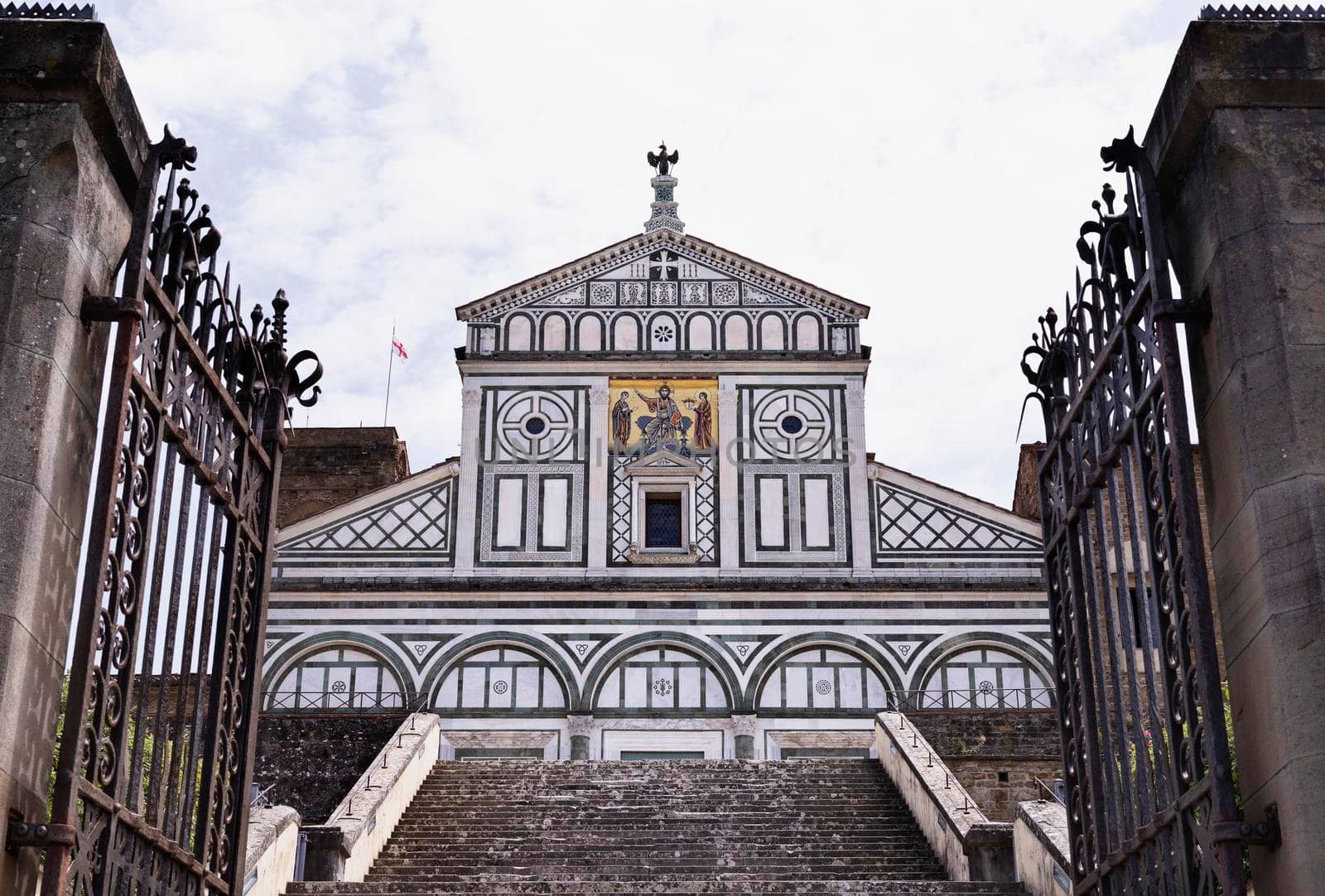 Abbey of San Miniato al Monte in Florence , Tuscany , considered one of the finest examples of  Florentine Romanesque style  ,decorated with marble in geometric patterns