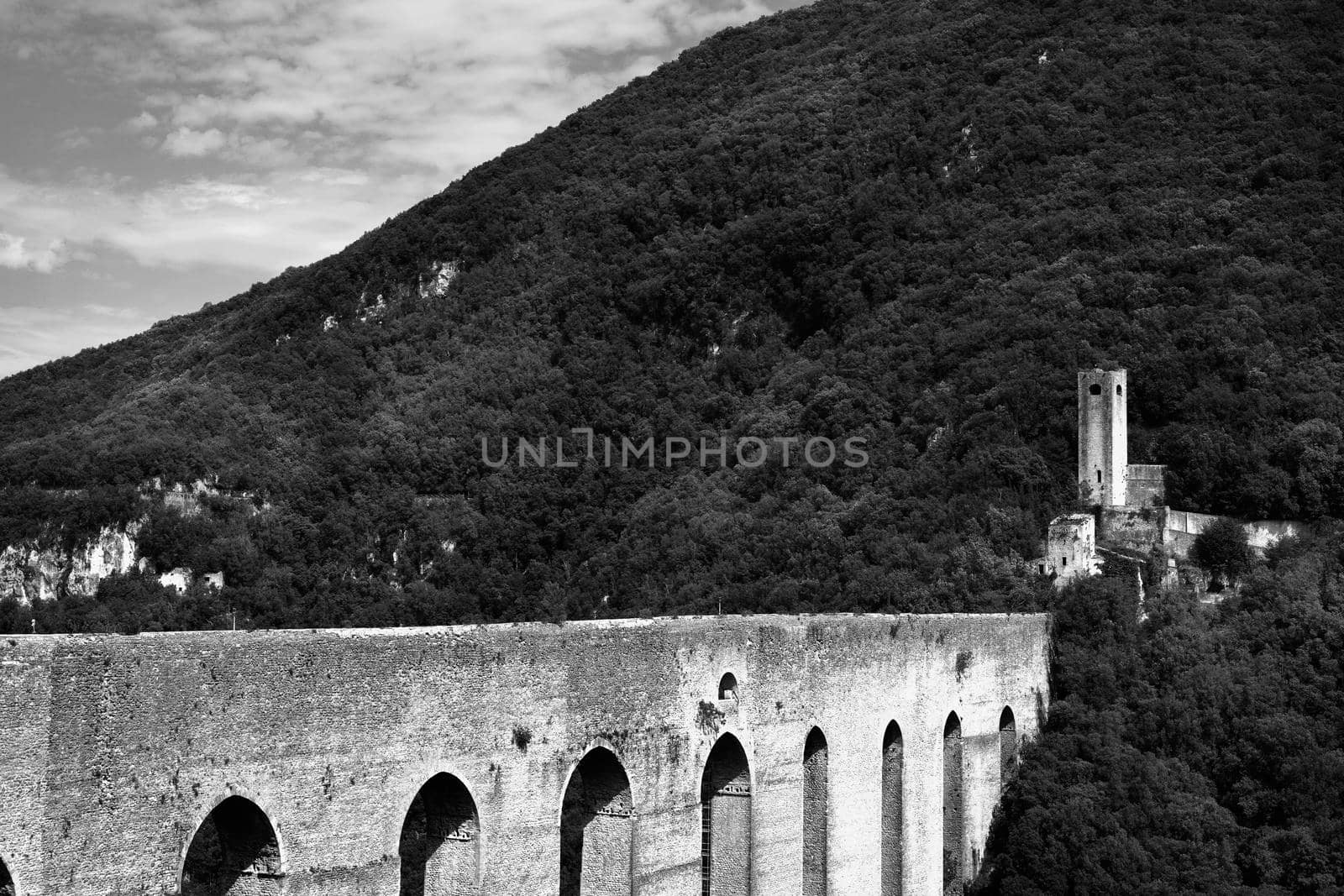 Spoleto , Italy , Ponte delle Torri in black and white  , arched  bridge of towers  in limestone , it worked as aqueduct and bridge