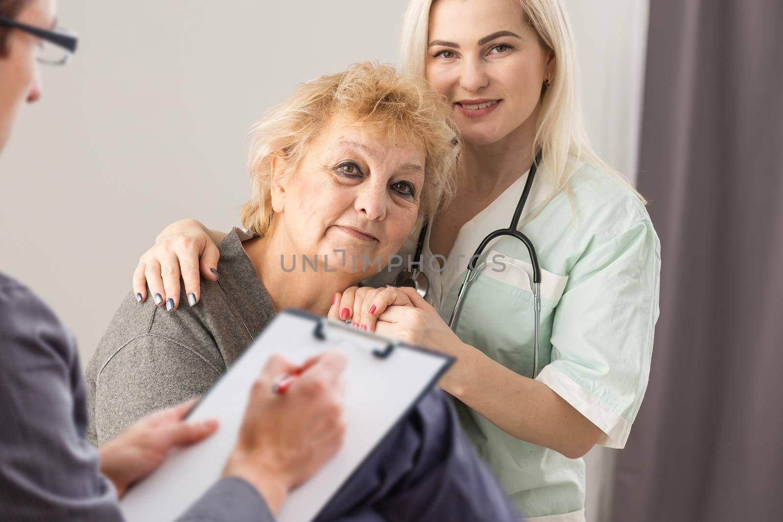 Parkinson and alzheimer female senior elderly patient with professional doctor consult in or counsel diagnosis health in hospital. Medical healthcare concept. by Andelov13