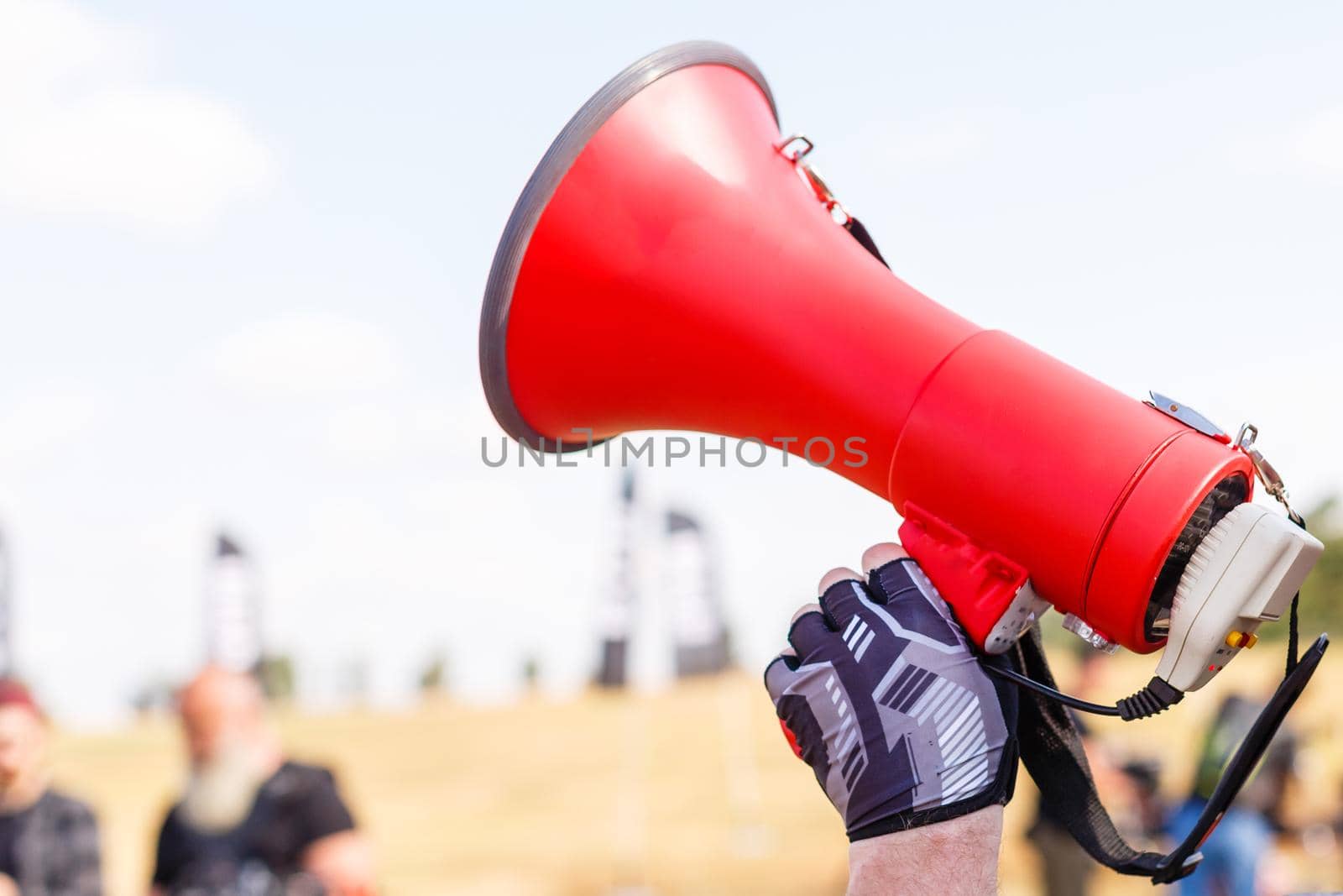 man standing screaming with mouthpiece