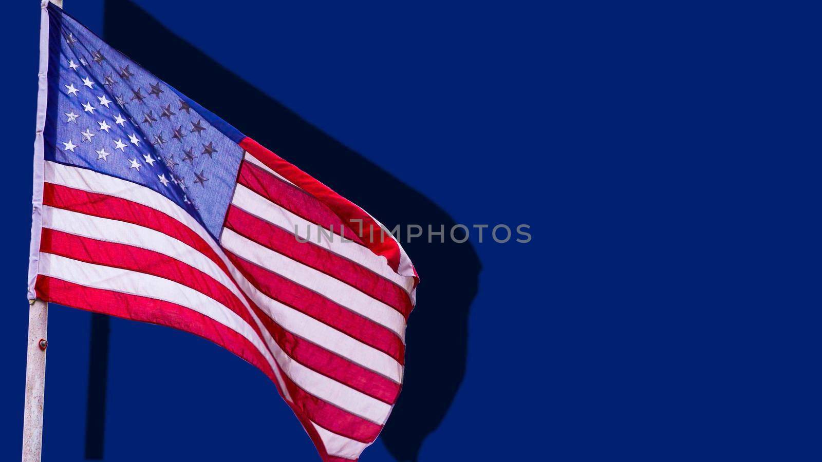 American flag waving on blue background. illustration by Andelov13