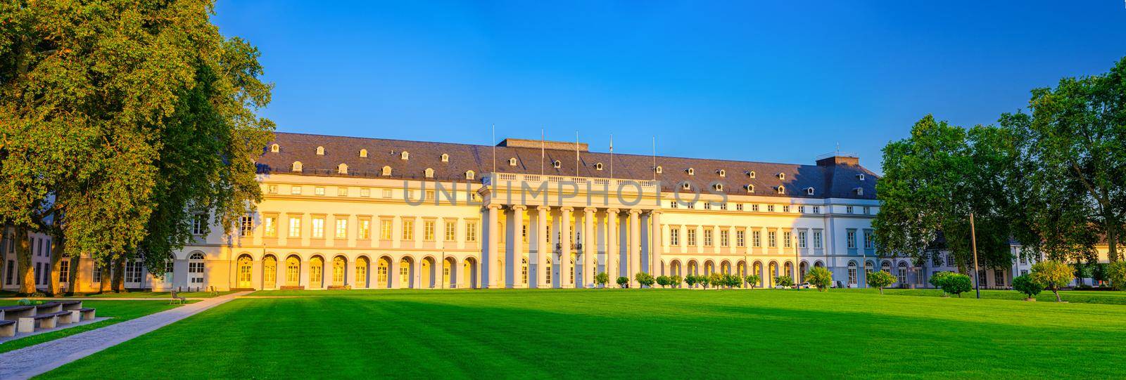 Koblenz, Germany, August 23, 2019: Electoral Palace Schloss building and Schlossvorplatz green grass lawn square in Koblenz historical city centre, blue sky background, Rhineland-Palatinate state