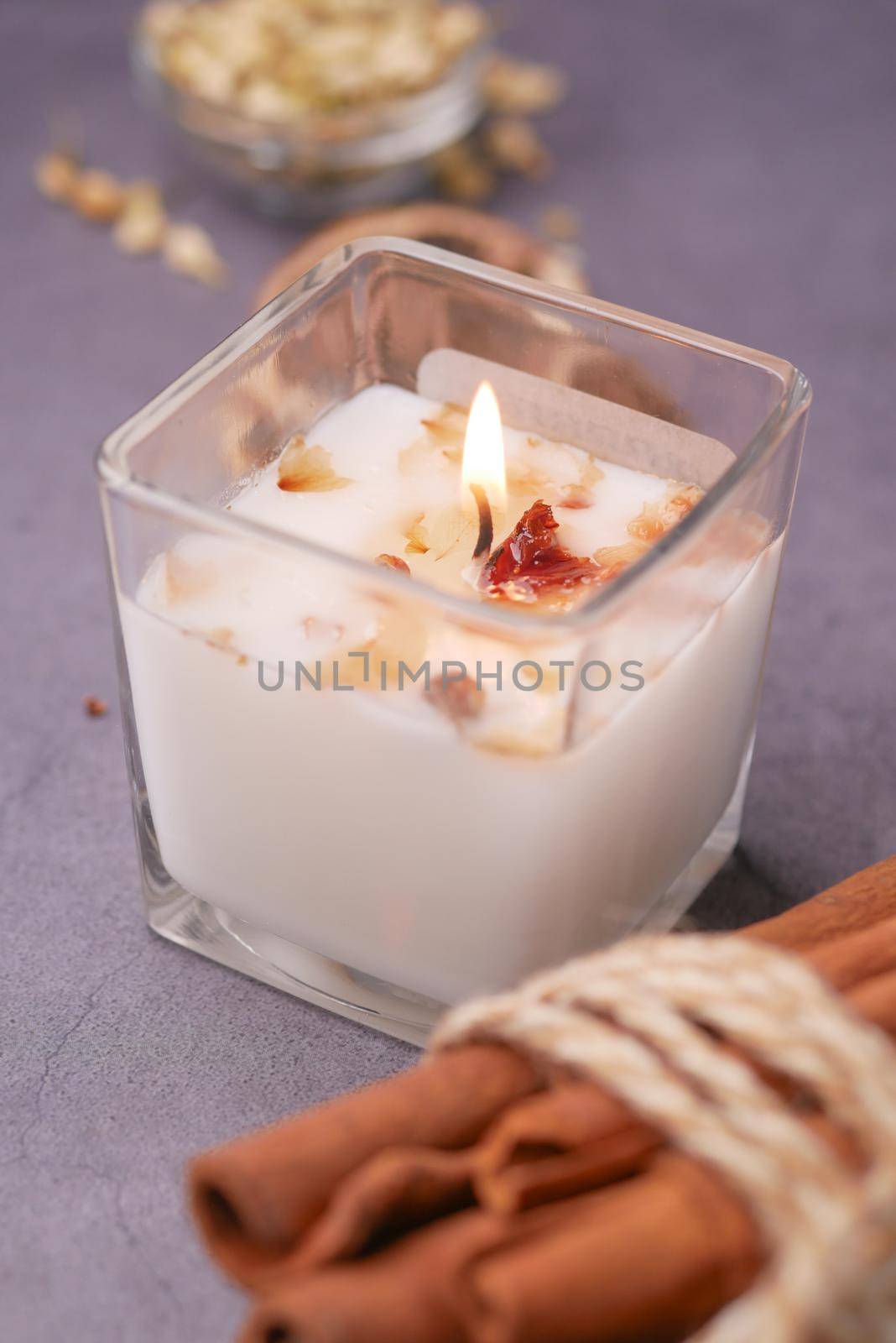 Burning scented candles for relax on black background .