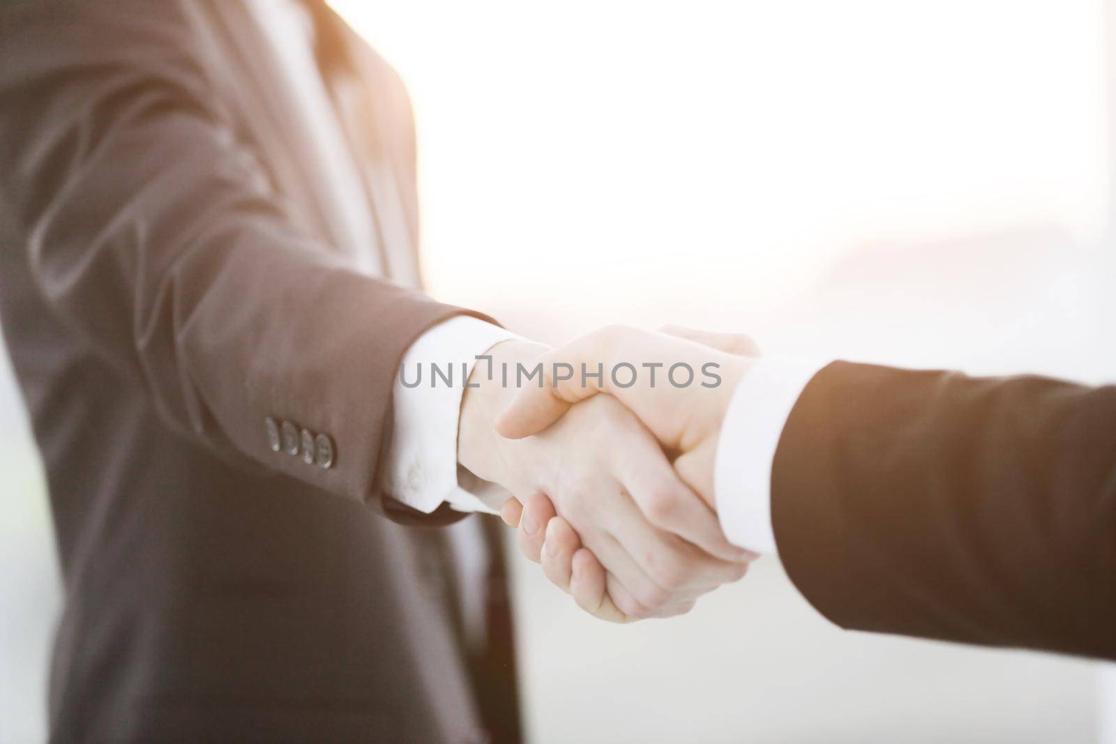 close up.business handshake over blurry background. by SmartPhotoLab