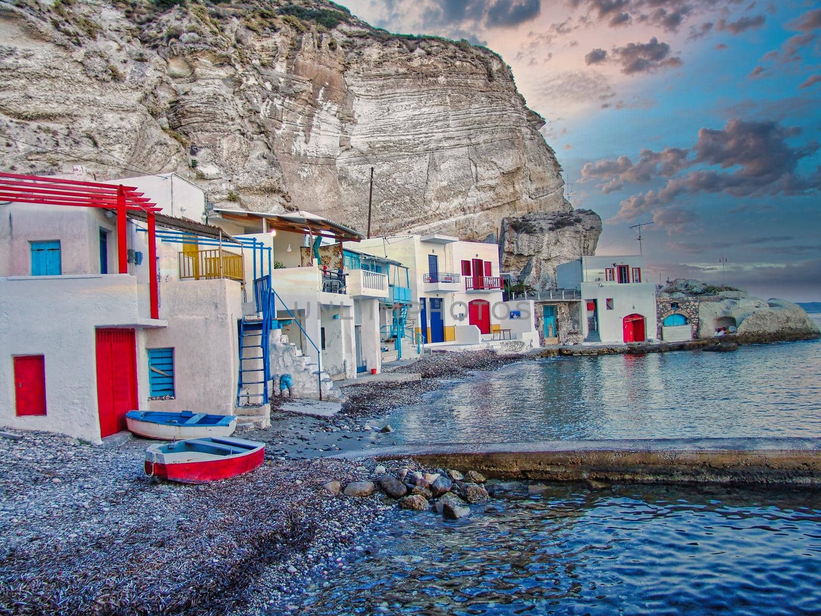 Scenic picturesque greek fishing village Klima with traditional houses and colorful windows and doors In Milos island, Greece